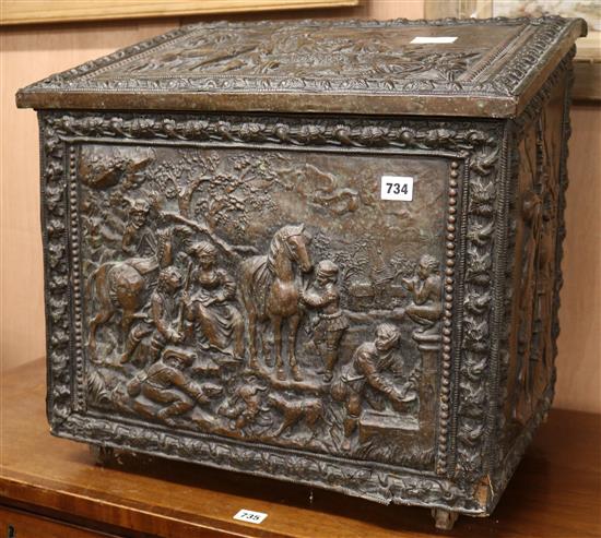 An embossed brass log box, W.56cm